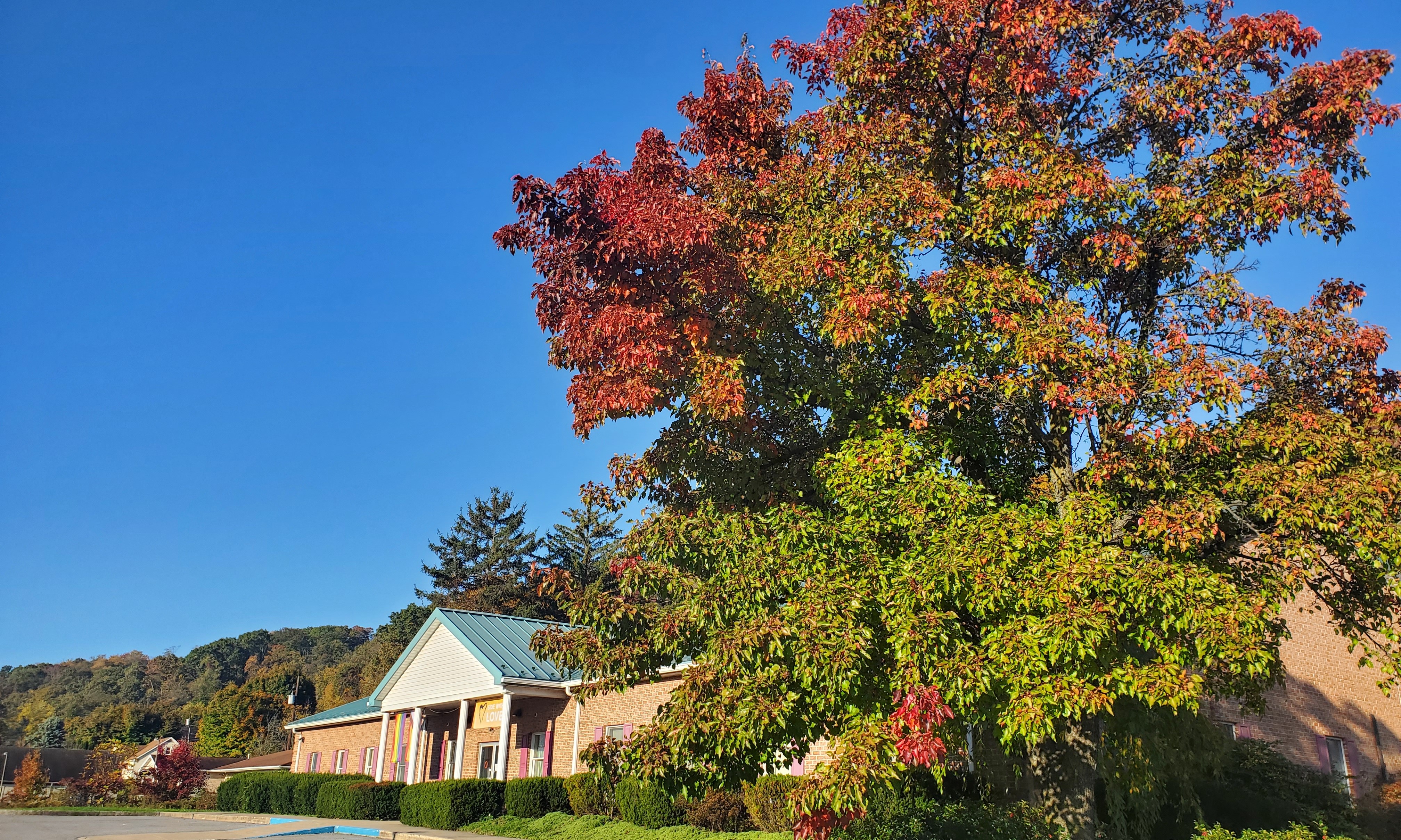 Front of UUCSV church building in fall